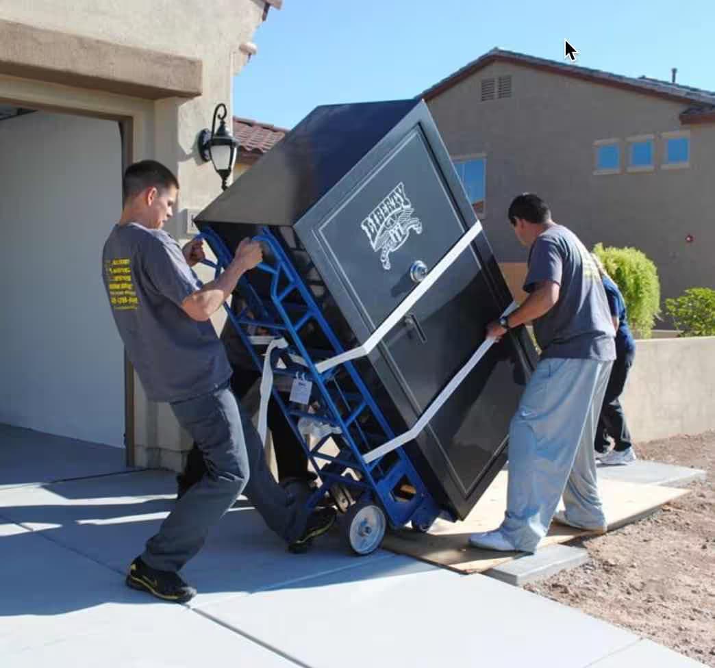 Spina's Moving Services team moving a large safe or crating a valuable antique with extreme care